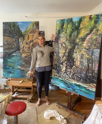 Judy In front of 2 large Paintings